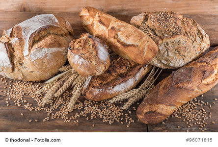 Composition of various breads, on wooden background